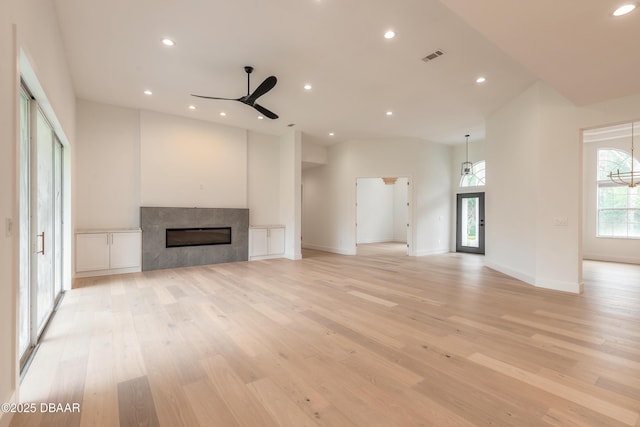 unfurnished living room featuring ceiling fan and light wood-type flooring