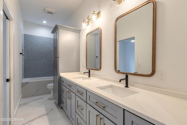 full bathroom with vanity, shower / washtub combination, and toilet