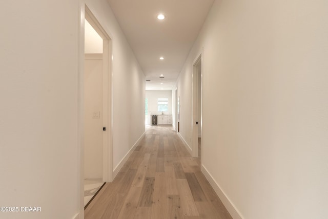 corridor featuring light hardwood / wood-style floors