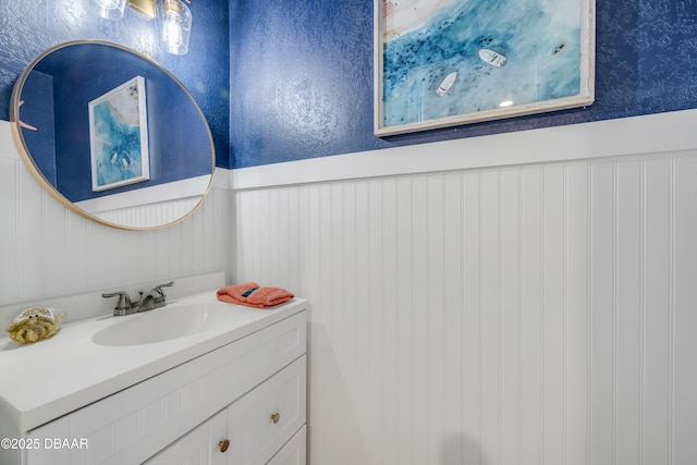 2122 S Atlantic Ave Unit 2122, New Smyrna Beach, FL 32169 - bathroom with vanity and wainscoting