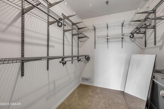 464 Bouchelle Dr Unit 104, New Smyrna Beach, FL 32169 - spacious closet featuring visible vents and carpet
