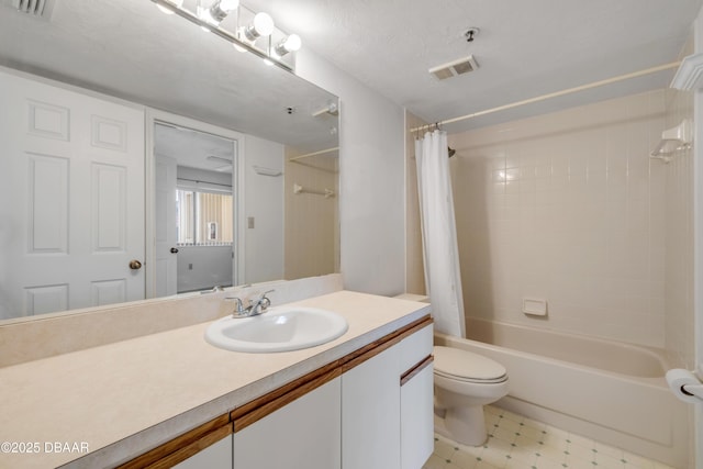 464 Bouchelle Dr Unit 104, New Smyrna Beach, FL 32169 - full bathroom featuring toilet, visible vents, vanity, and shower / tub combo with curtain