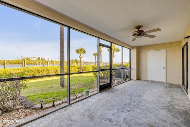 464 Bouchelle Dr Unit 104, New Smyrna Beach, FL 32169 - unfurnished sunroom with a ceiling fan and a water view