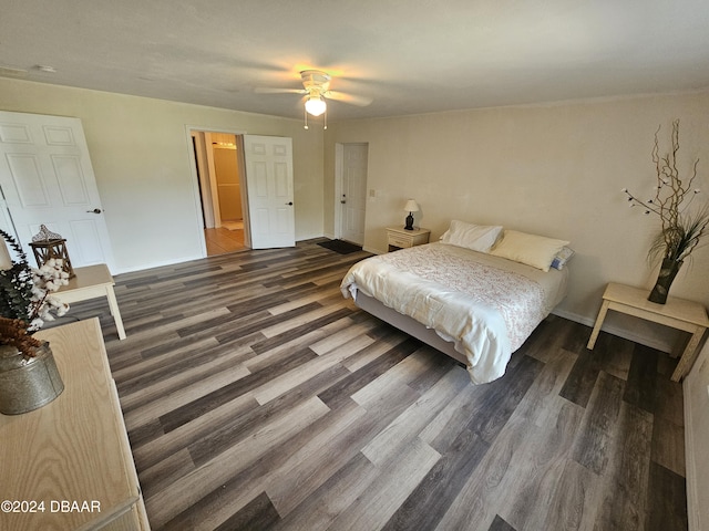 bedroom with ceiling fan, baseboards, and wood finished floors