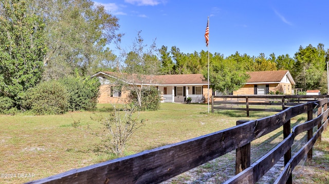 single story home with a front yard