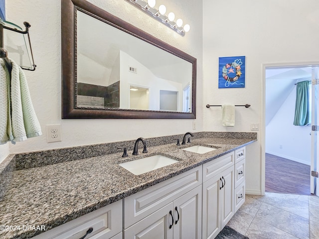 bathroom with vanity and hardwood / wood-style flooring