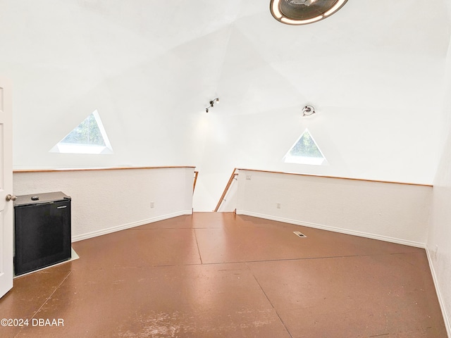 interior space featuring a wealth of natural light and lofted ceiling with skylight