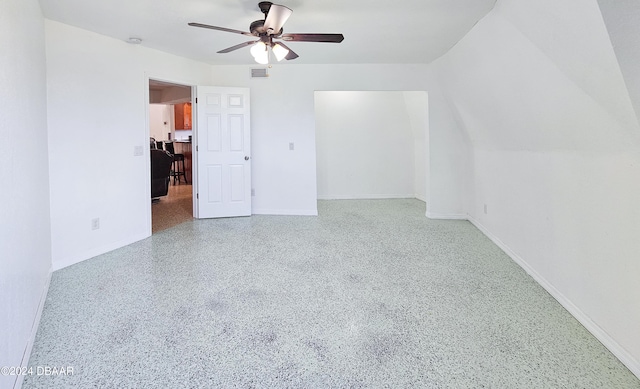 additional living space featuring ceiling fan