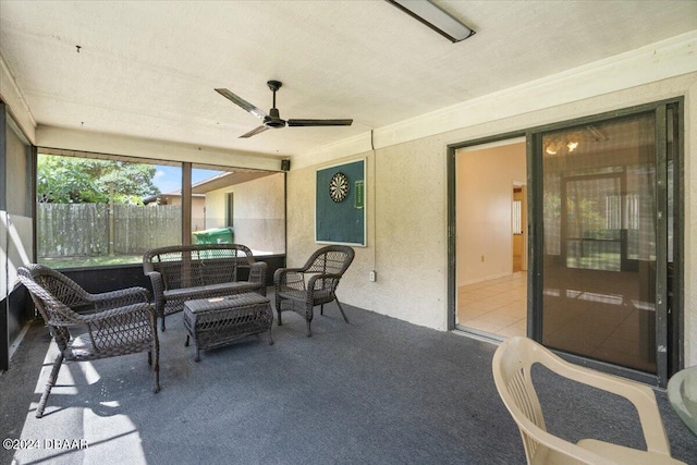 sunroom / solarium with ceiling fan