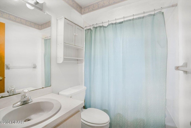 bathroom featuring vanity, toilet, and a shower with shower curtain