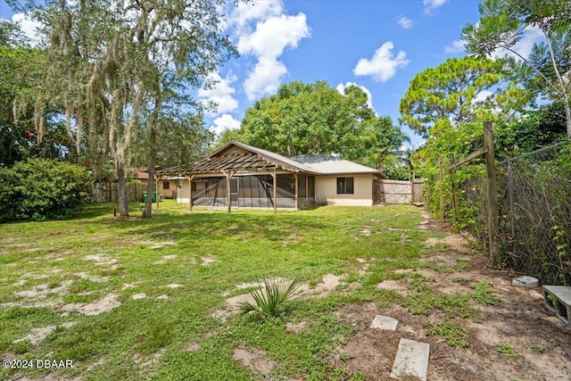 view of yard with a sunroom