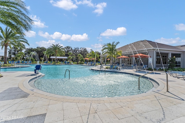 view of swimming pool featuring a patio area