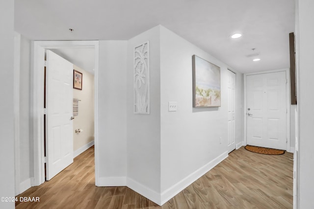 corridor featuring light hardwood / wood-style flooring