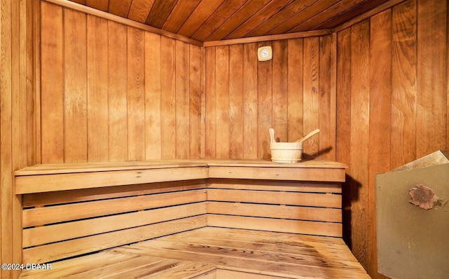 view of sauna with wood walls and wood ceiling