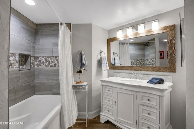 bathroom featuring vanity and shower / bathtub combination with curtain