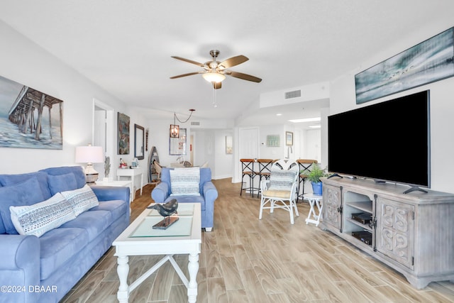 living room featuring ceiling fan and light hardwood / wood-style flooring