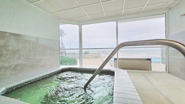 view of pool with an indoor in ground hot tub