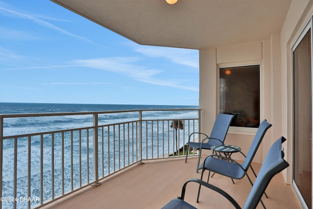 balcony featuring a water view