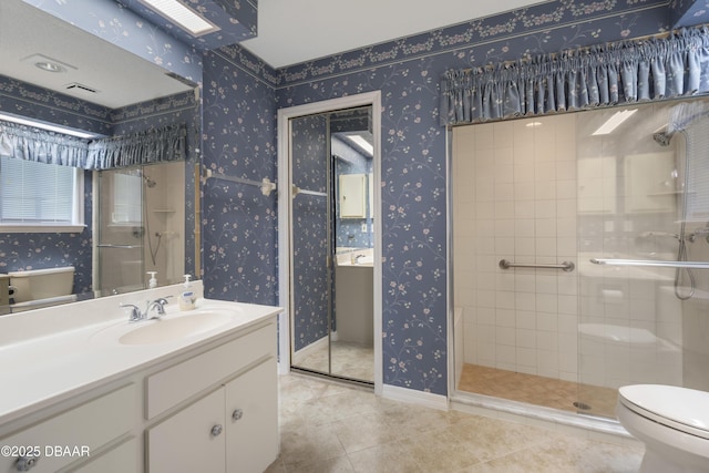 136 Deer Lake Cir, Ormond Beach, FL 32174 - bathroom with toilet, wallpapered walls, a shower stall, vanity, and tile patterned floors