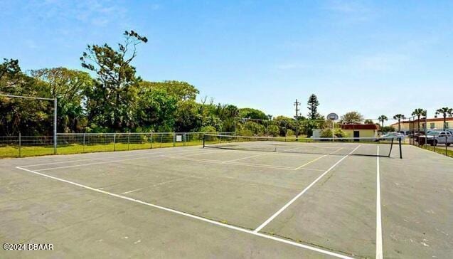 view of tennis court with fence