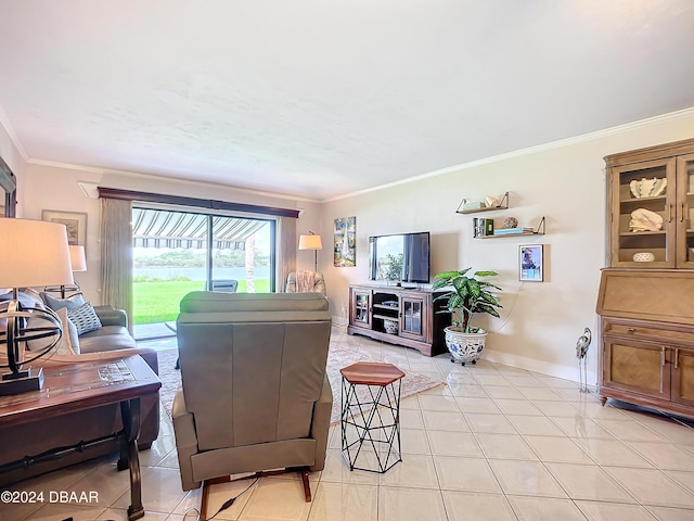 living room featuring baseboards, light tile patterned floors, and crown molding