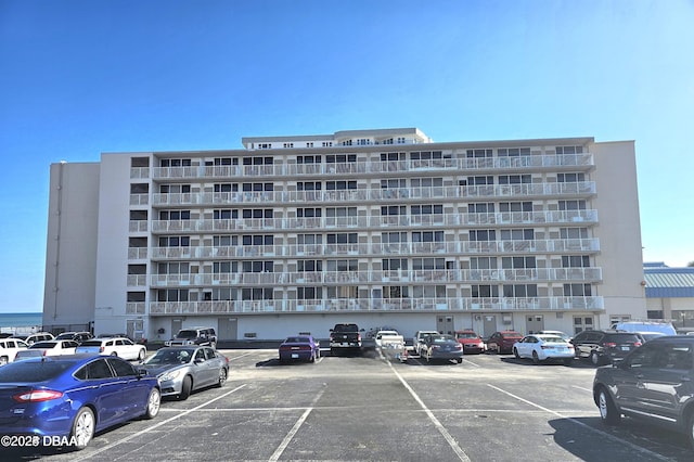 view of property with uncovered parking