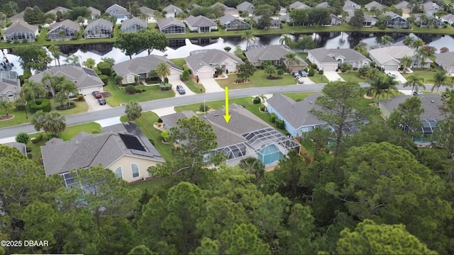 aerial overview of property's location with nearby suburban area and a nearby body of water