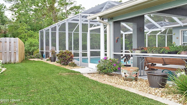 rear view of property with glass enclosure, an outdoor pool, and a patio