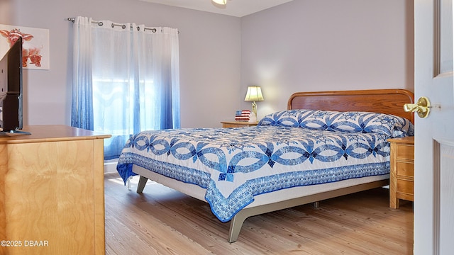 bedroom featuring wood finished floors
