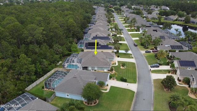 aerial view of residential area featuring a large body of water