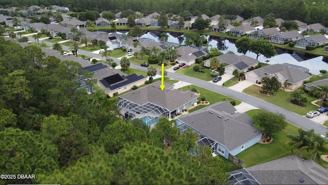 aerial overview of property's location featuring nearby suburban area and a nearby body of water