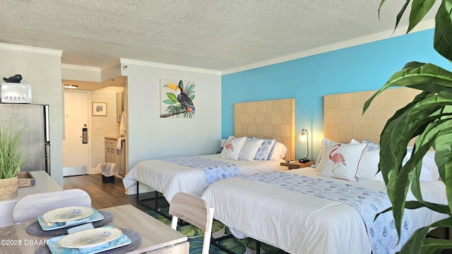 bedroom with a textured ceiling, connected bathroom, crown molding, and dark hardwood / wood-style floors