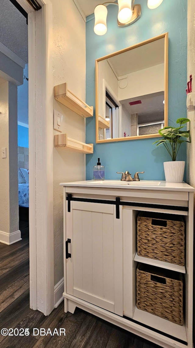 bathroom featuring vanity and hardwood / wood-style flooring