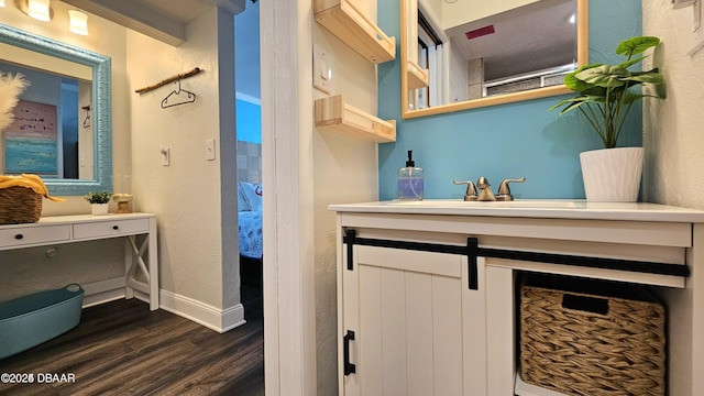 bathroom featuring vanity and hardwood / wood-style flooring