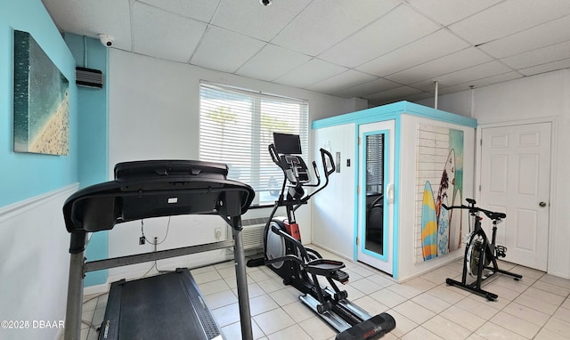 workout room featuring a paneled ceiling