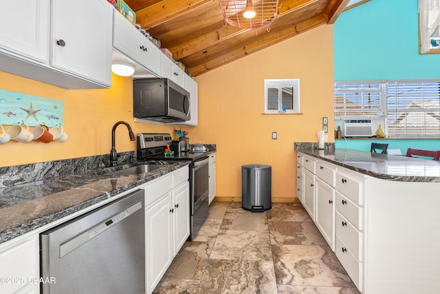 kitchen featuring lofted ceiling, a sink, stainless steel appliances, white cabinets, and wood ceiling