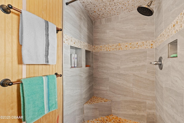 bathroom featuring a tile shower