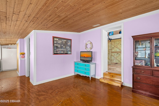 interior space with wooden ceiling, baseboards, and wood finished floors