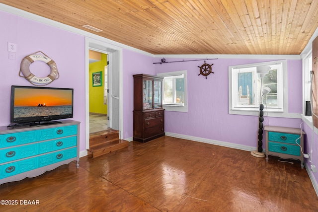 unfurnished bedroom with wooden ceiling, baseboards, and finished concrete floors