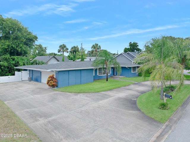 49 Bosarvey Cir, Ormond Beach, FL 32176 - ranch-style home featuring driveway, a gate, and roof with shingles