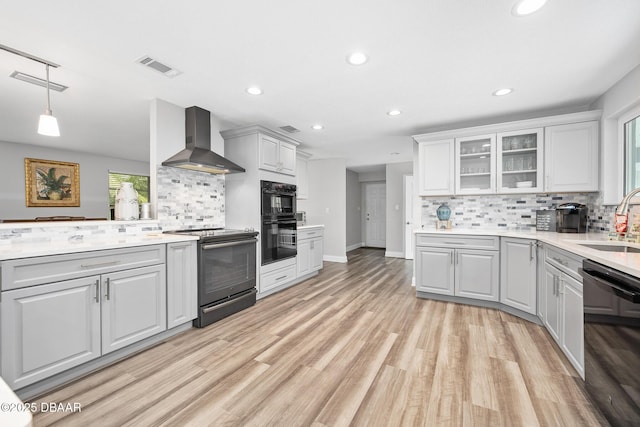 49 Bosarvey Cir, Ormond Beach, FL 32176 - kitchen with electric range, wall chimney range hood, dishwasher, tasteful backsplash, and recessed lighting