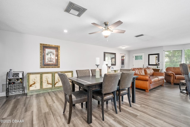 49 Bosarvey Cir, Ormond Beach, FL 32176 - dining room with wood finished floors, a ceiling fan, and recessed lighting