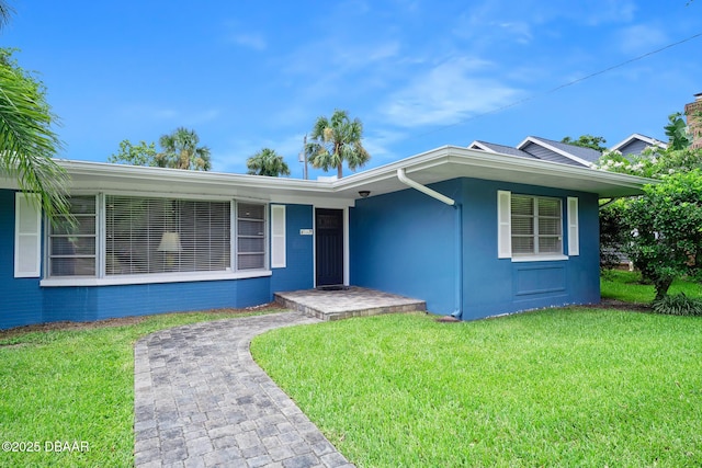 49 Bosarvey Cir, Ormond Beach, FL 32176 - single story home with a front lawn and stucco siding