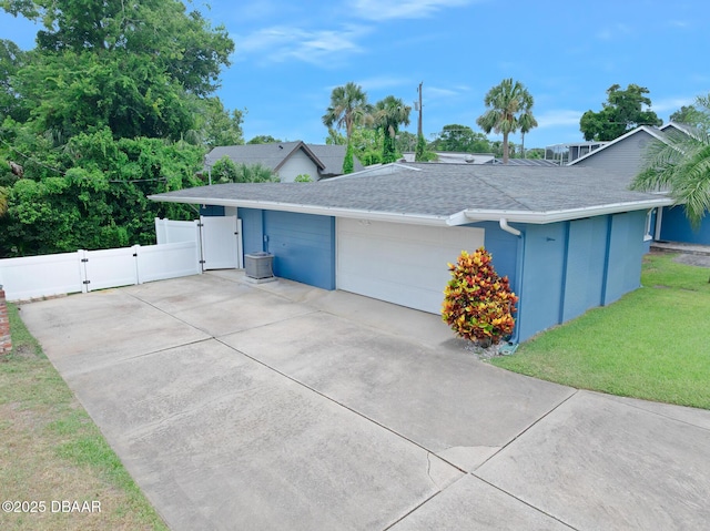 49 Bosarvey Cir, Ormond Beach, FL 32176 - ranch-style house featuring a gate, a shingled roof, an attached garage, and driveway