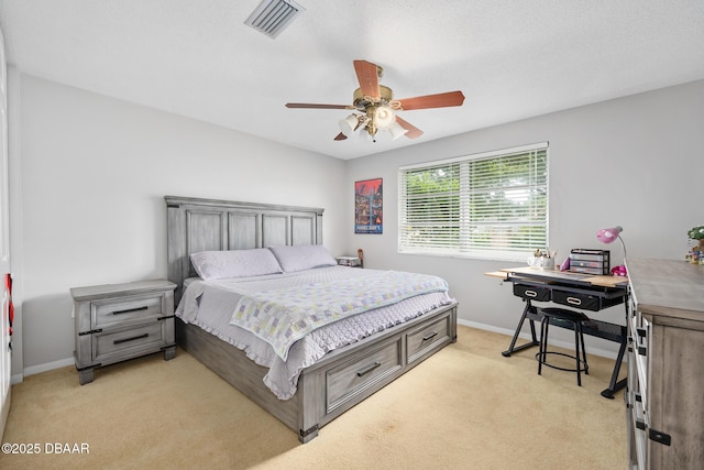 49 Bosarvey Cir, Ormond Beach, FL 32176 - bedroom with light carpet, a desk, and a ceiling fan
