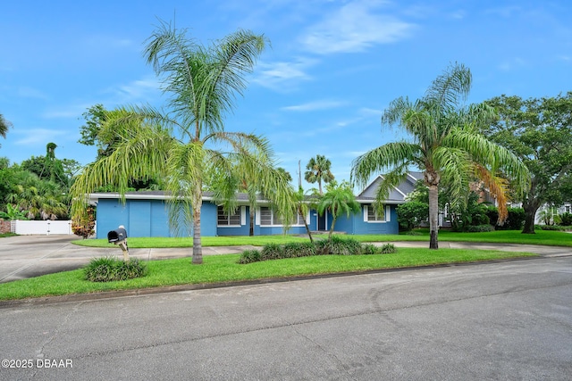 49 Bosarvey Cir, Ormond Beach, FL 32176 - ranch-style house with driveway and a front yard