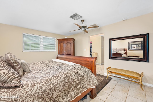 49 Bosarvey Cir, Ormond Beach, FL 32176 - bedroom featuring light tile patterned flooring, a ceiling fan, and a walk in closet