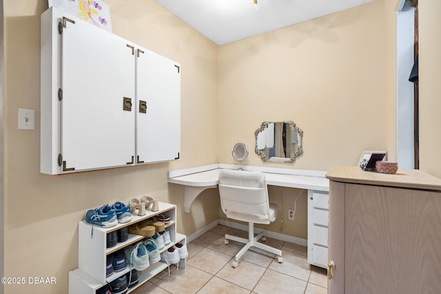49 Bosarvey Cir, Ormond Beach, FL 32176 - office area featuring built in desk and light tile patterned floors