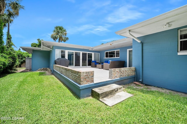 49 Bosarvey Cir, Ormond Beach, FL 32176 - back of property featuring an outdoor living space, a lawn, and a patio area