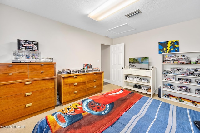 49 Bosarvey Cir, Ormond Beach, FL 32176 - bedroom featuring attic access, light carpet, and a textured ceiling
